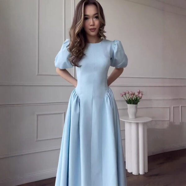 💙 Grace in Every Step – The Soft Elegance Puff Sleeve Maxi Dress Slip into timeless style — and let confidence flow with every step.